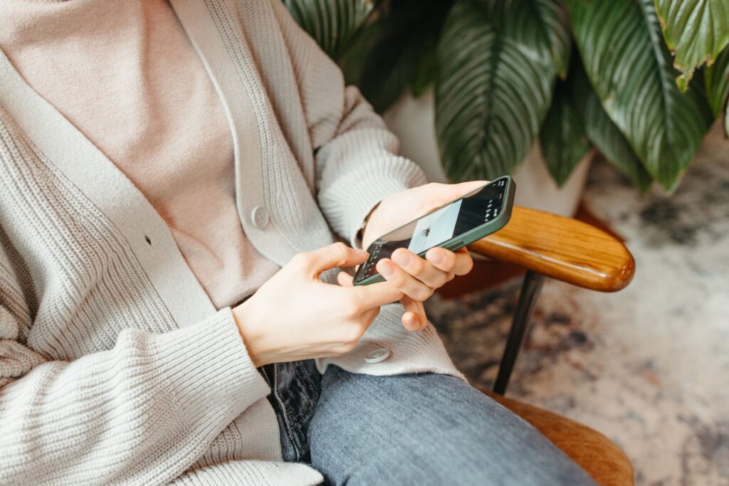 a female holding her cellphone