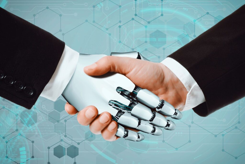 image of a robot handshaking a human hand