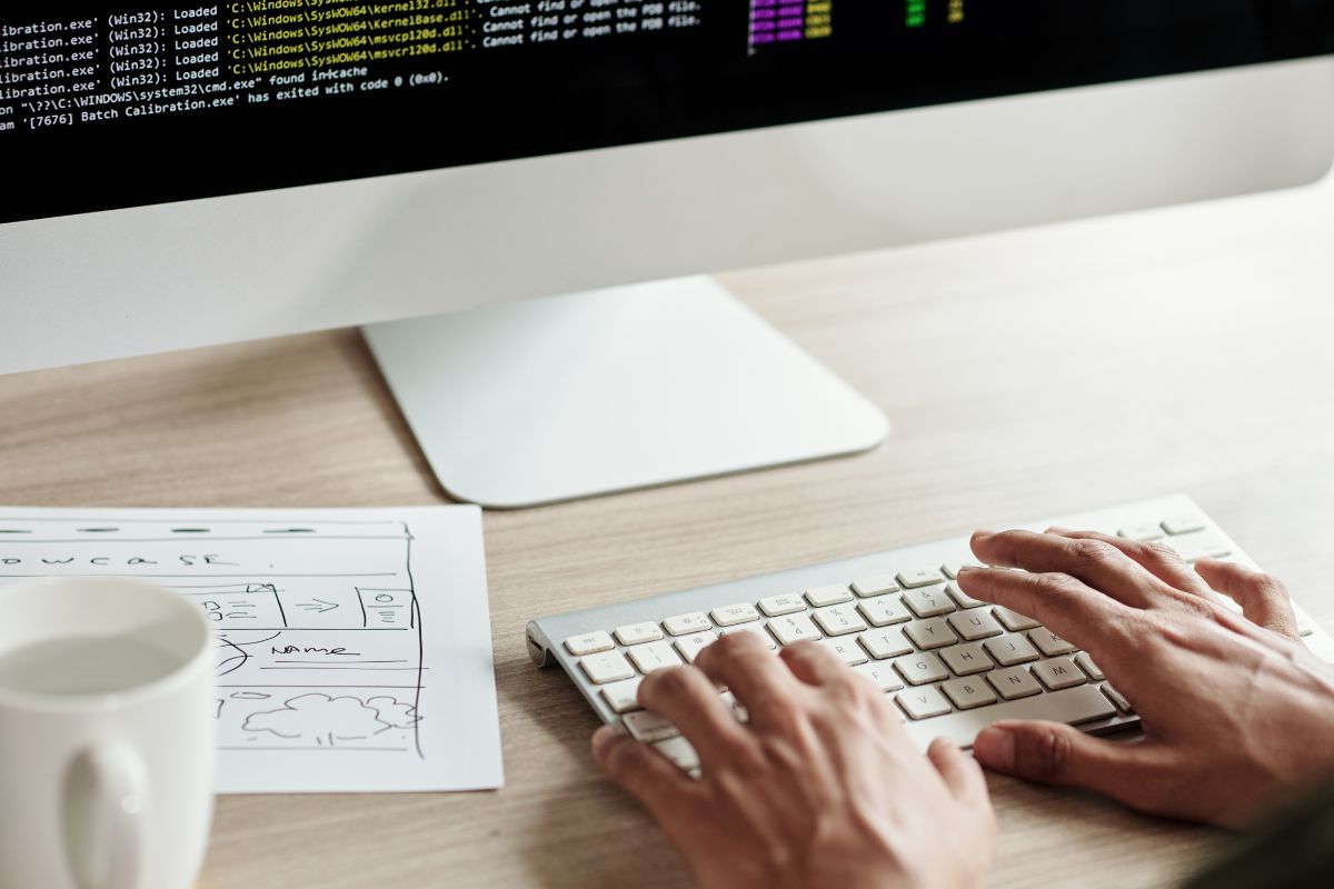 image of a frond end developer coding a program using programing skills